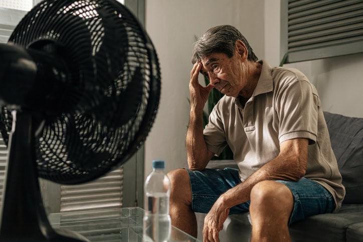 Old man struggling with heat.